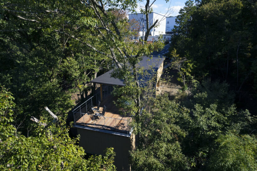 OHArchitecture embeds stepped camma villa and office onto sloping site in otsu, japan