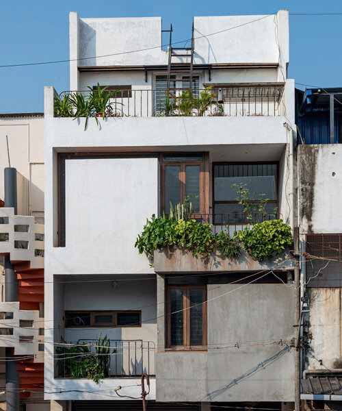 overlapping white volumes compose compact house by rahul pudale design in india