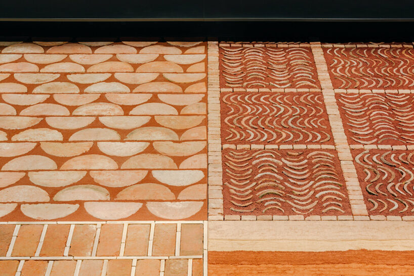 Hermès depicts a jockey’s silk jersey using brick, stone, wood & earth at milan design week