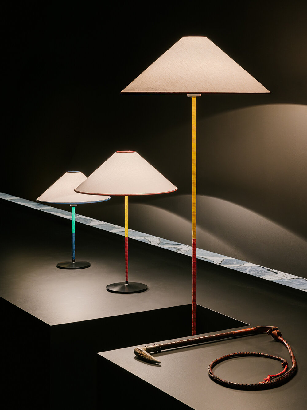 Hermès depicts a jockey’s silk jersey using brick, stone, wood & earth at milan design week