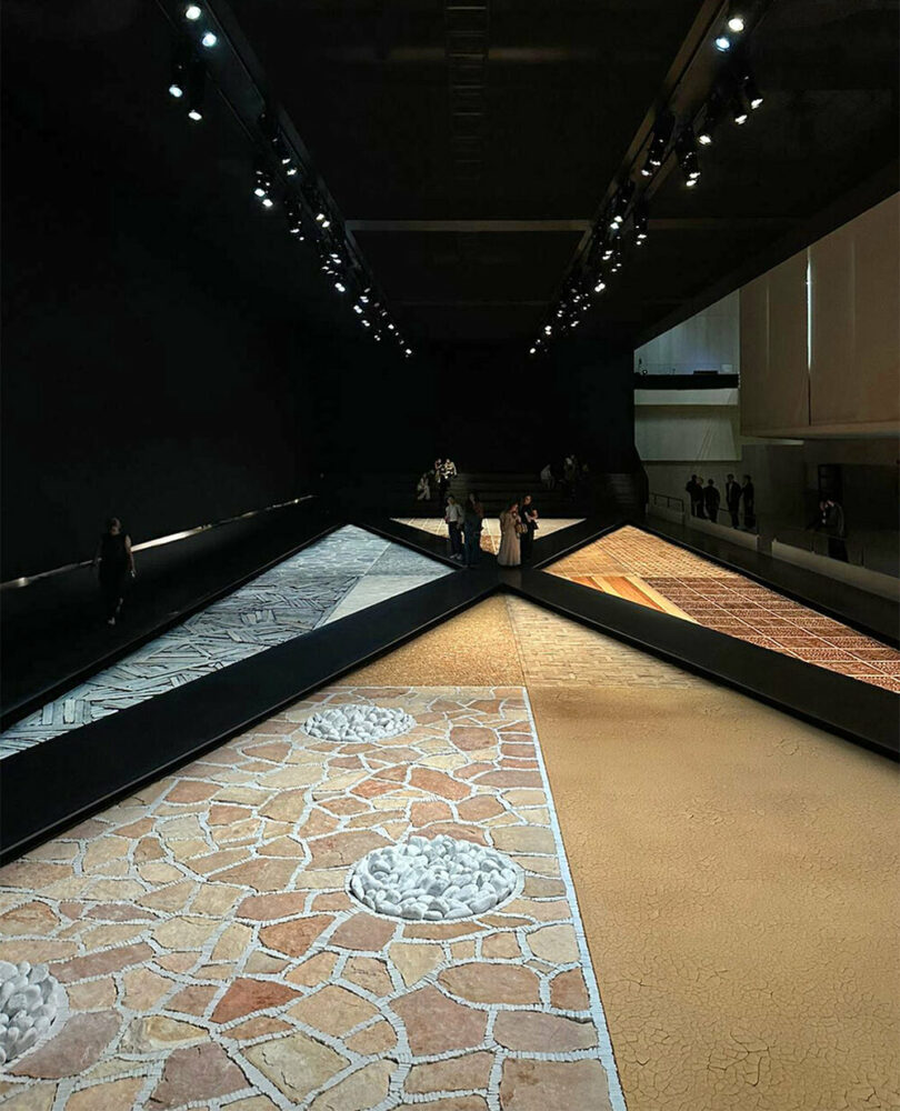 Hermès depicts a jockey’s silk jersey using brick, stone, wood & earth at milan design week