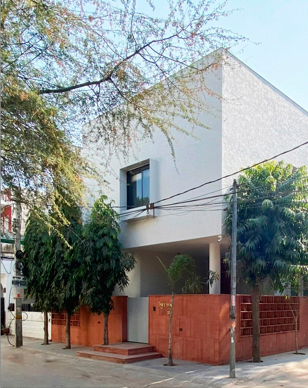 red sandstone jali lattice encloses jaipur house's facade by nuar studios