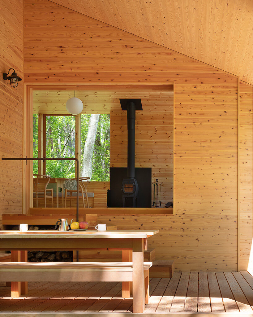 K+S architects' wooden forest hut is a terraced refuge in woods of japan