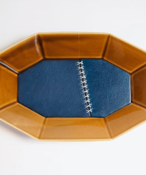 roee ben yehuda's kawatsugi salvages fragmented ceramics with leather interventions