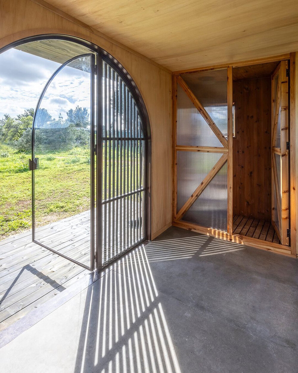 madeiguincho repurposes cargo container as tiny house with sunken roof terrace