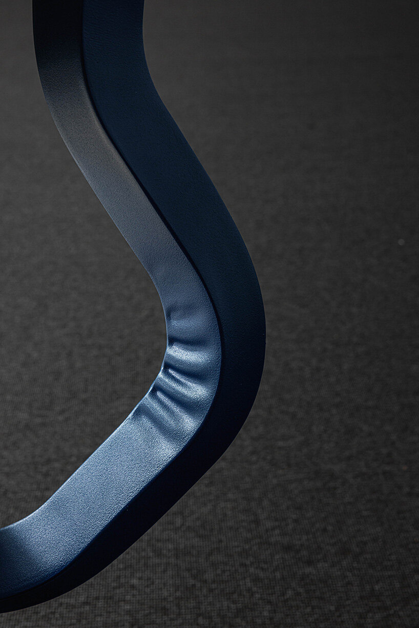 AMDL CIRCLE bends steel-back mara TYPO chair with robust yet soft creases