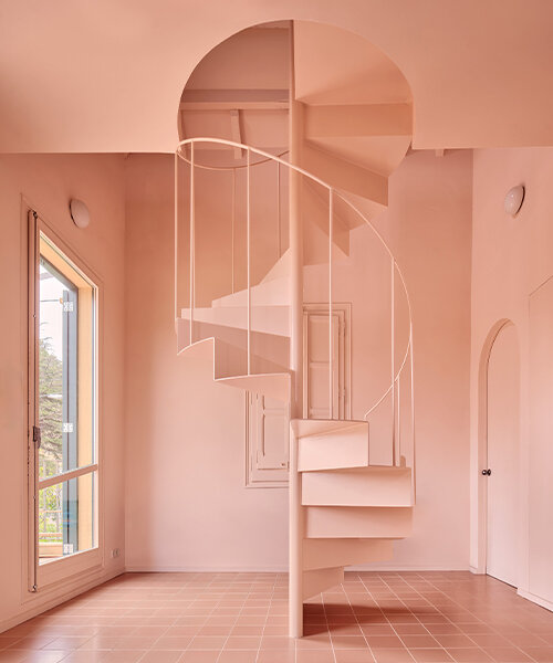 a light peach tone engulfs every corner inside this two-family house in barcelona