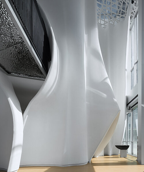 the veil: groundwork architects sculpts sinuous interiors like draped fabric