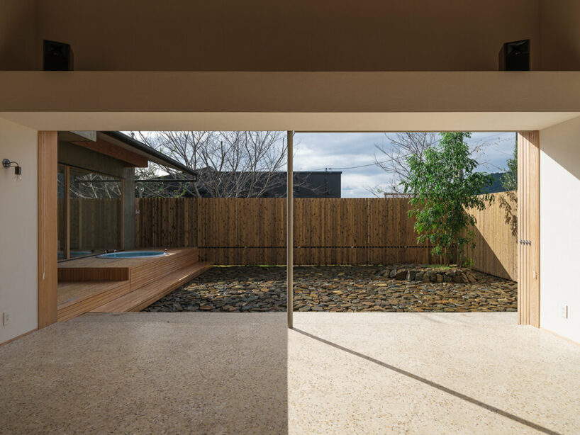a viewing room playfully protrudes from tetra works' rental villa in hiroshima