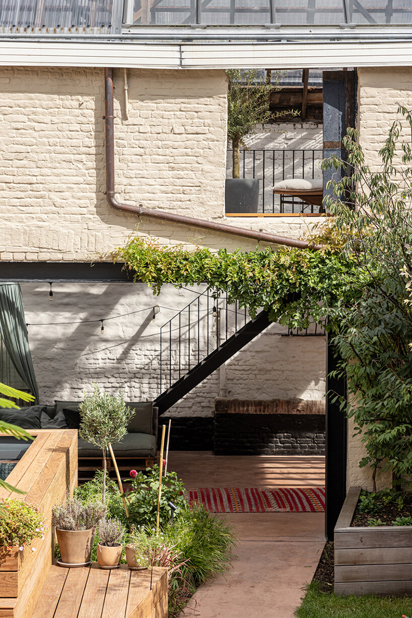 slaughterhouse café turns into sunlit multi-level residence by atelier vens vanbelle in belgium