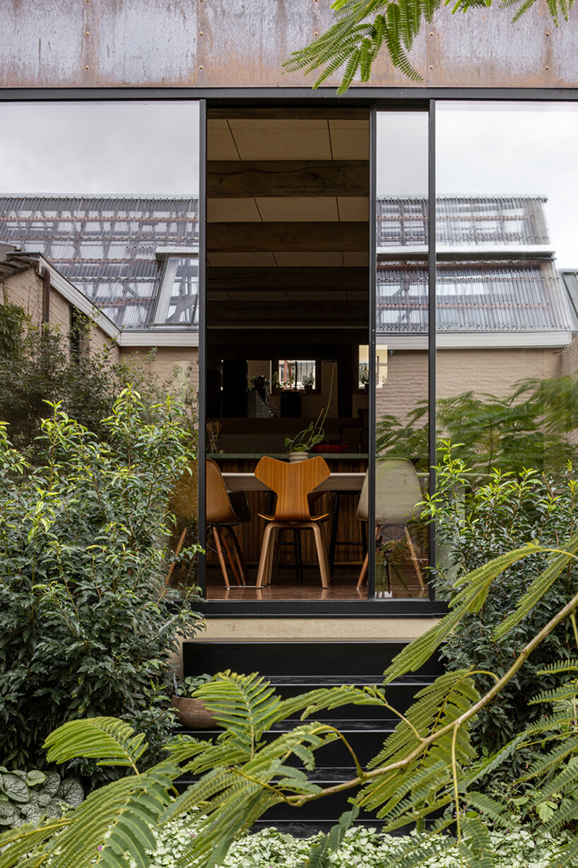 slaughterhouse café turns into sunlit multi-level residence by atelier vens vanbelle in belgium