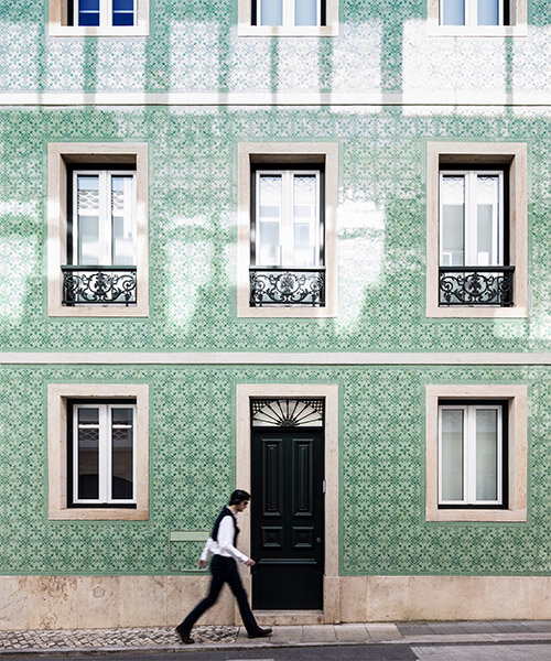 camarim arquitetos restores lisbon house with decorative facade of patterned tiles