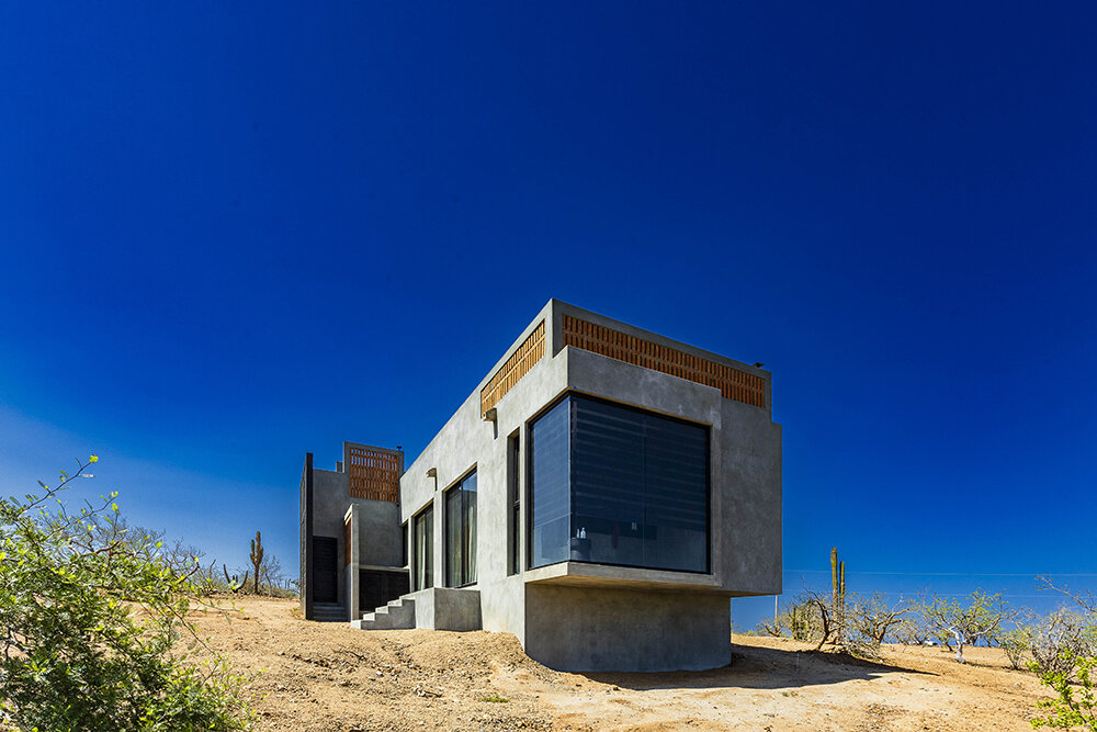 latticed stone motifs punctuate casa que da's folded concrete body in cerritos, mexico