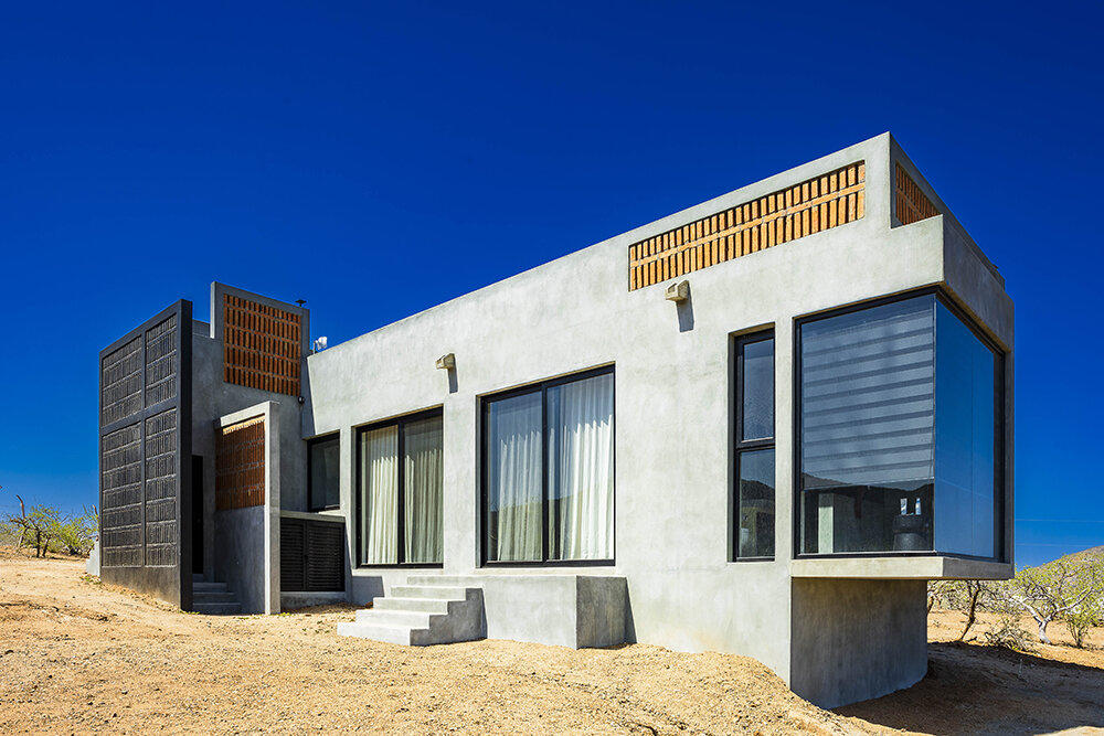 latticed stone motifs punctuate casa que da's folded concrete body in cerritos, mexico