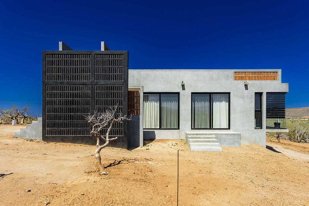 latticed stone motifs punctuate casa que da's folded concrete body in cerritos, mexico