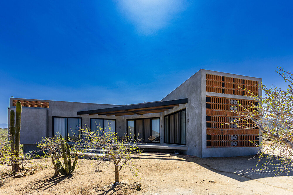 latticed stone motifs punctuate casa que da's folded concrete body in cerritos, mexico