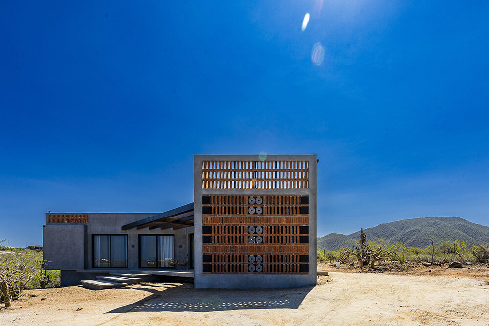 latticed stone motifs punctuate casa que da's folded concrete body in cerritos, mexico
