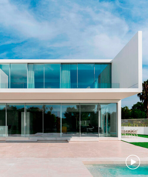 ruben muedra arquitectura's wisdom house stacks two white glazed prisms in valencia