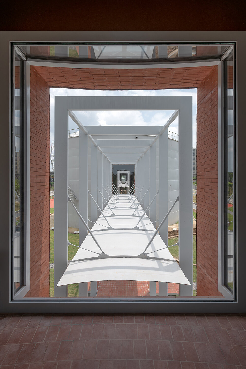 AIM architecture repurposes four oil tanks into a skylit community hub in changzhou