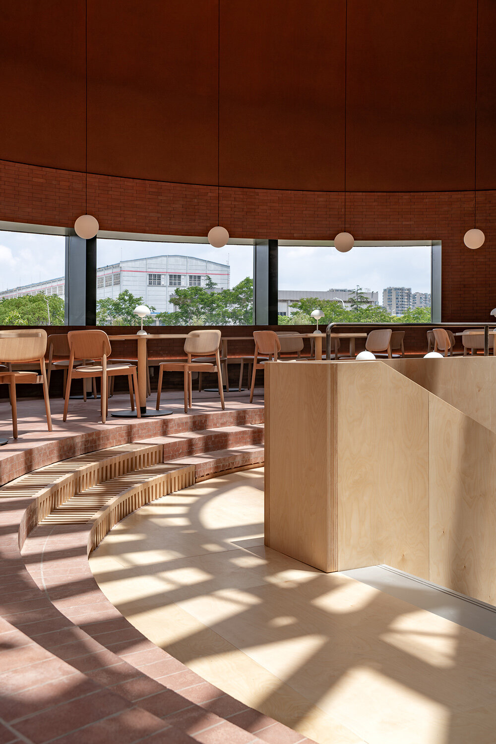 AIM architecture repurposes four oil tanks into a skylit community hub in changzhou