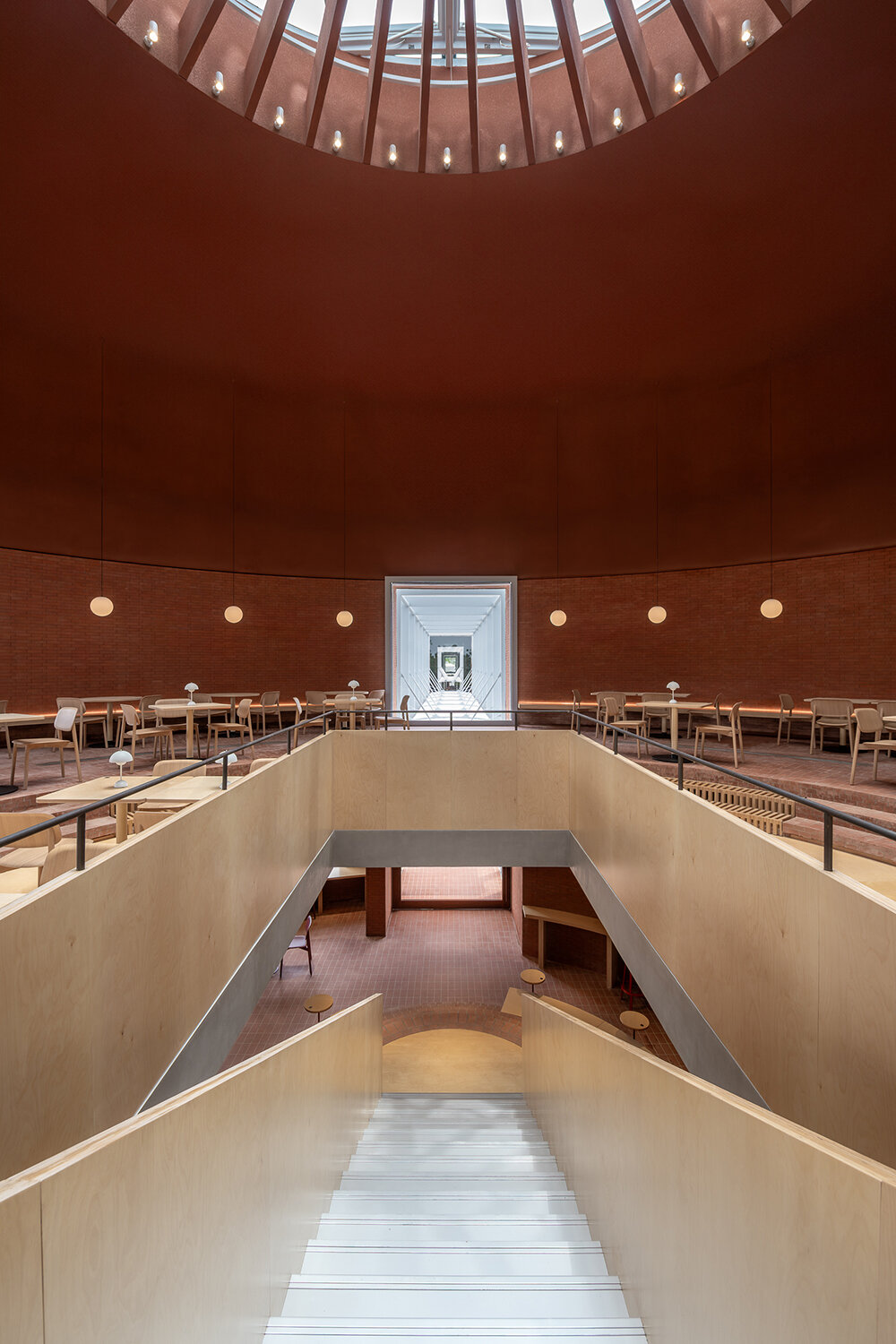 AIM architecture repurposes four oil tanks into a skylit community hub in changzhou