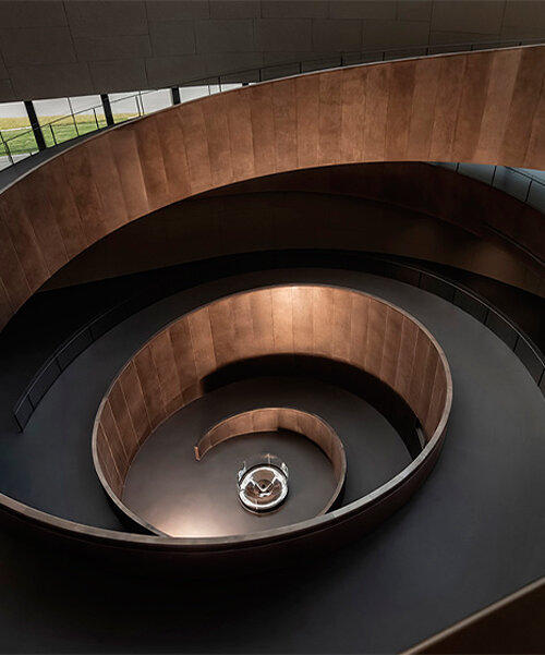 csd.design's interior layout for sanxingdui museum in china forms around copper spiral ramp