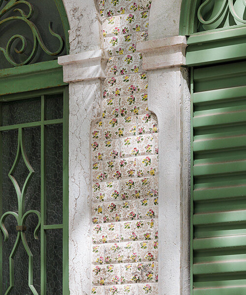 studio fragmentos revives lisbon townhouse, restoring its floral-painted facade