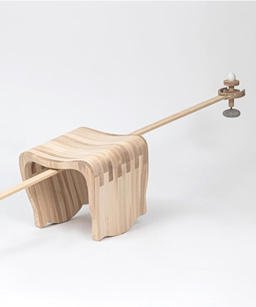 ahn kihyun’s playfully performative chair is intersected by a gimbal structure to balance eggs