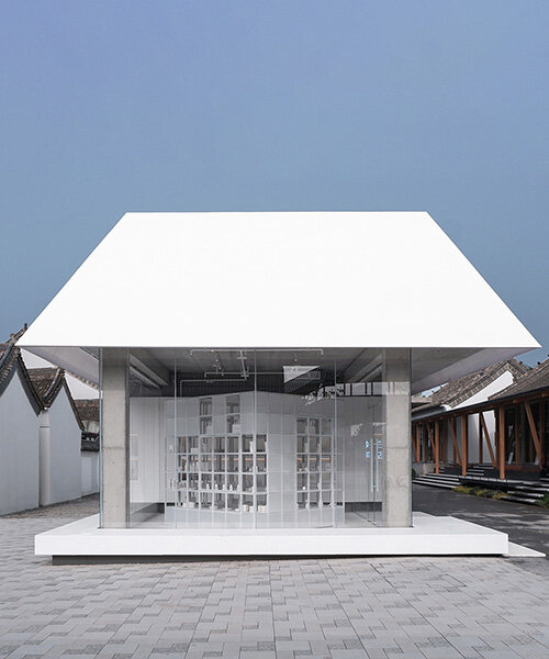 translucent pitched roof tops glass-clad store by designRESERVE in chinese village