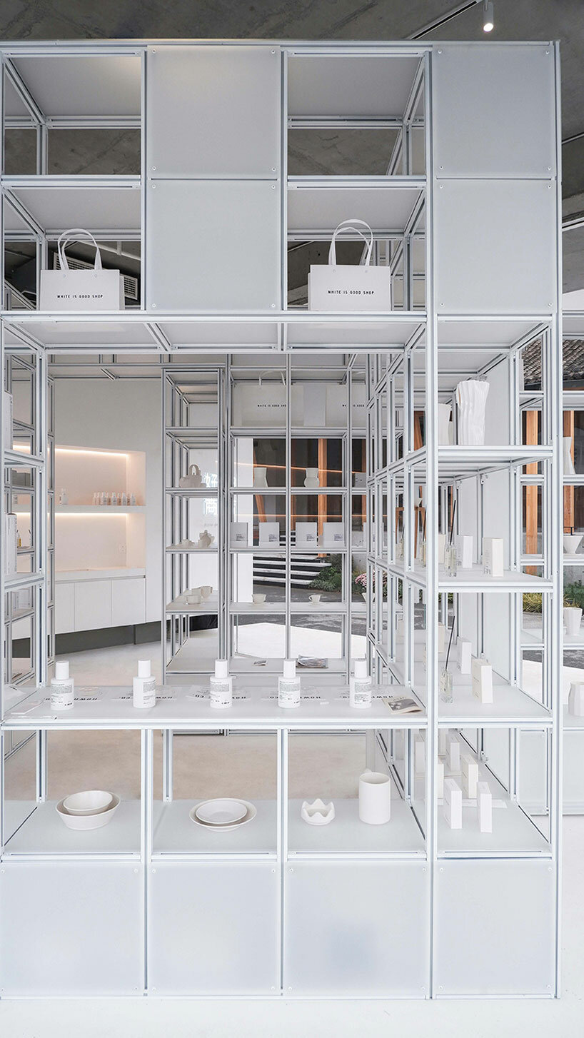 translucent pitched roof tops glass-clad store by designRESERVE in chinese village