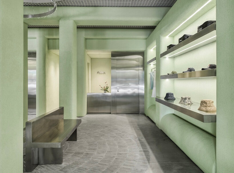 light green textured stucco walls envelop malbon miami golf boutique by 22RE