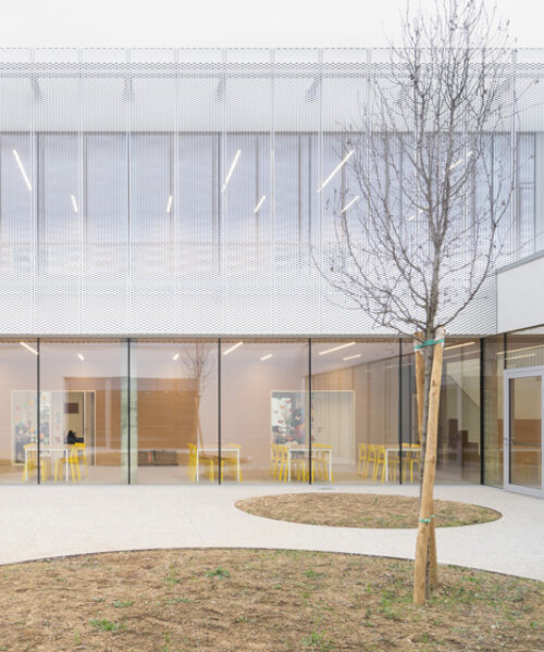 artico fracassi wraps italian school in glass and perforated encasing to bring the outdoors in