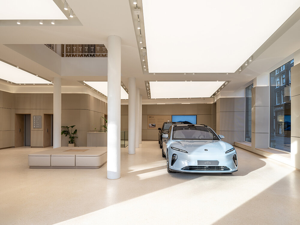 NIO house's amsterdam flagship by MVRDV culminates in an airy blue pavilion