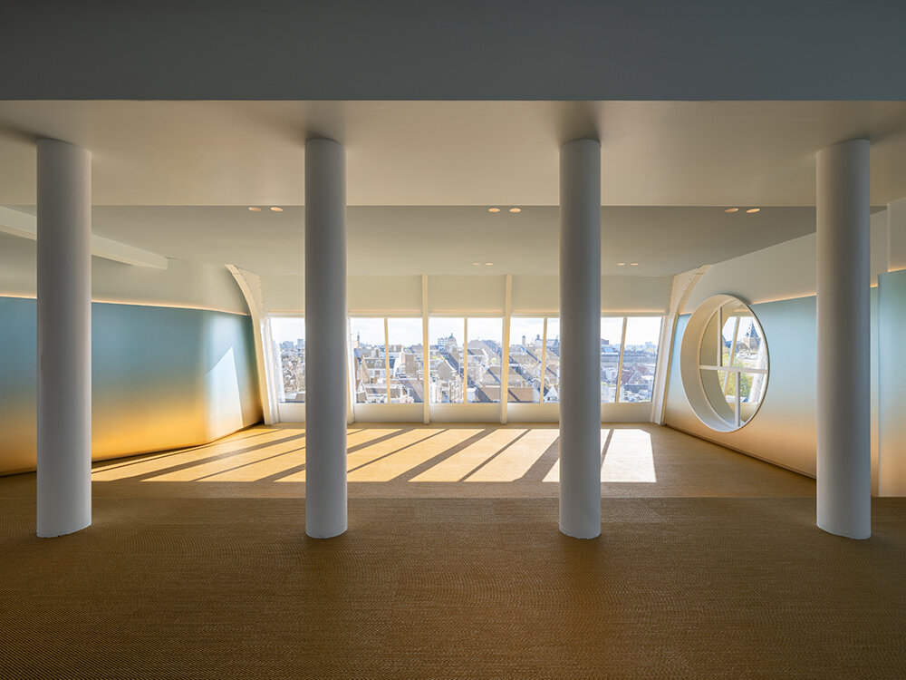 NIO house's amsterdam flagship by MVRDV culminates in an airy blue pavilion