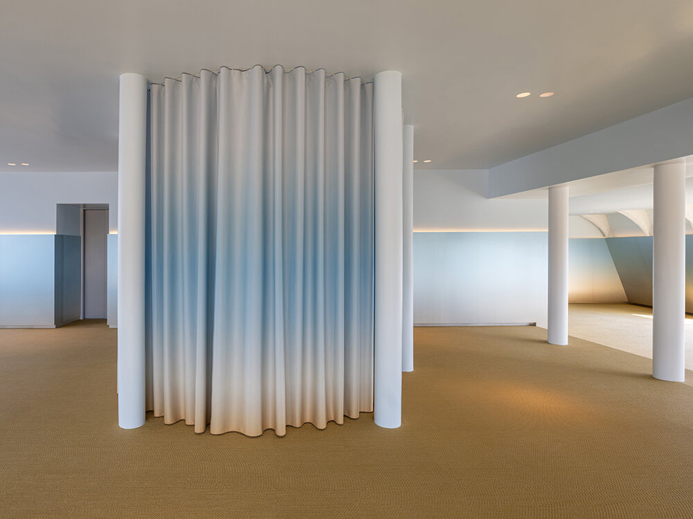 NIO house's amsterdam flagship by MVRDV culminates in an airy blue pavilion