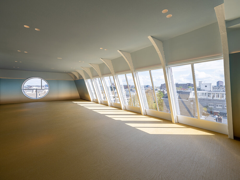 NIO house's amsterdam flagship by MVRDV culminates in an airy blue pavilion