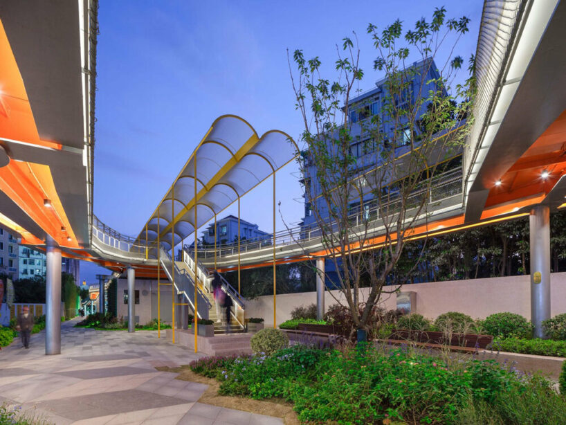atelier liu yuyang architects transforms former rail line into vine-like walking belt in shanghai