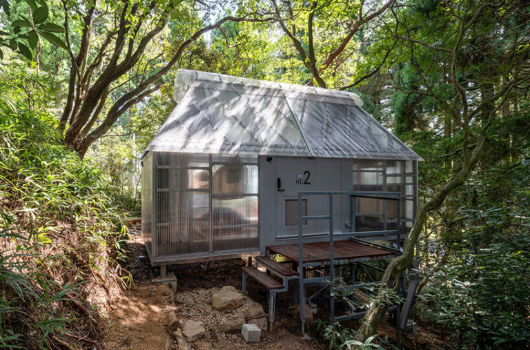 osamu morishita scatters translucent cabins among japanese forest