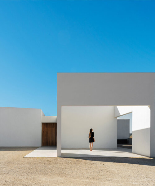 four solid white blocks outline wind house by ruben muedra arquitectura in spain
