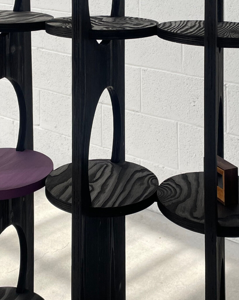 woocheol shin pierces dark wood furniture with circular openings for porthole series