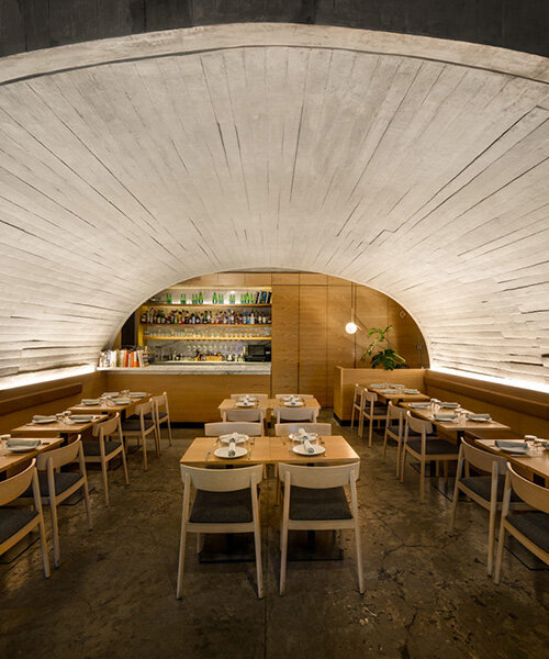 concrete arched vault shelters café-restaurant dining area in mexico city