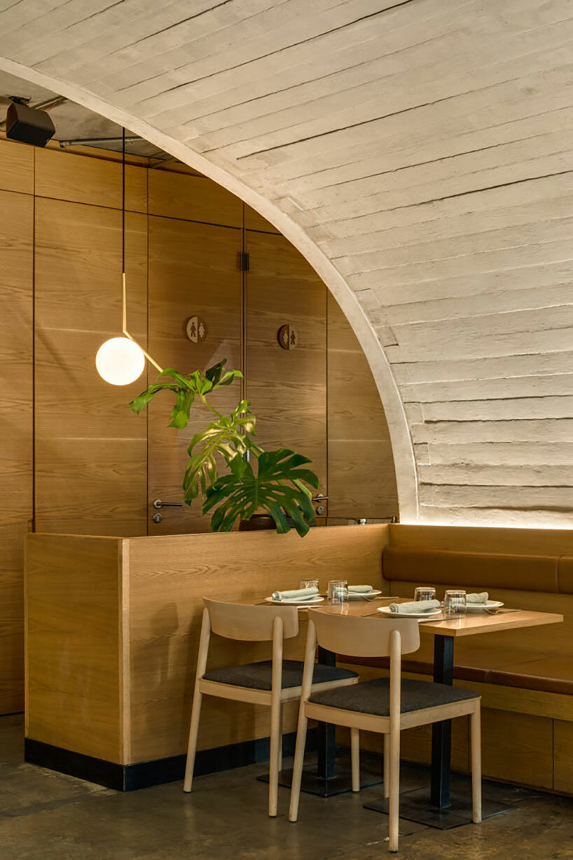 concrete arched vault shelters café-restaurant dining area in mexico city