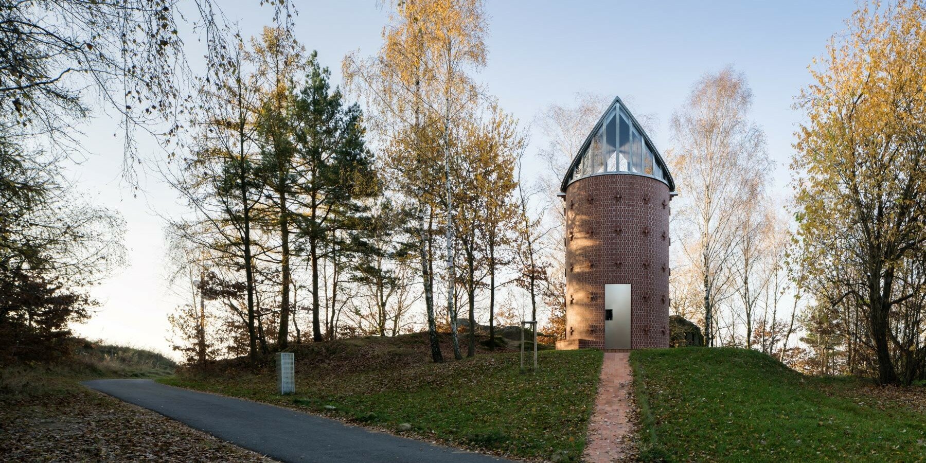 atypical gable roof replaces dome frescoes in czech brick chapel