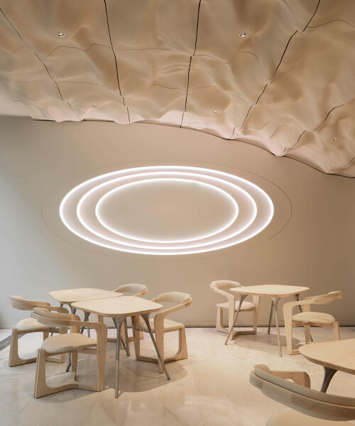 switzerland's CAAA restaurant greets diners under 3D printed ceiling evoking snowy alps