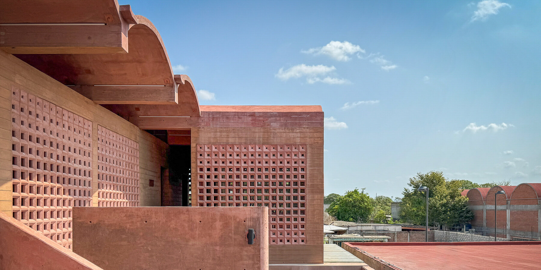 concrete-lattice-facade-oaxacan-community-hub-patterned-shadows-designboom-1800-02