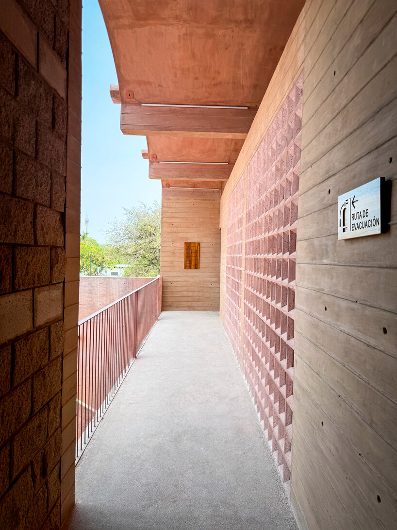 concrete lattice facade floods oaxacan community hub with patterned shadows