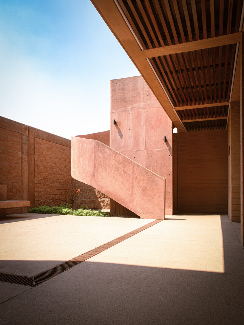 concrete lattice facade floods oaxacan community hub with patterned shadows