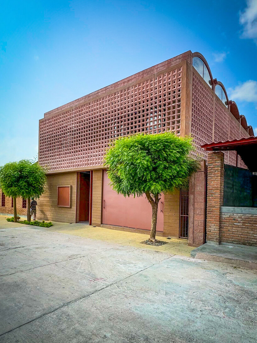 concrete lattice facade floods oaxacan community hub with patterned shadows