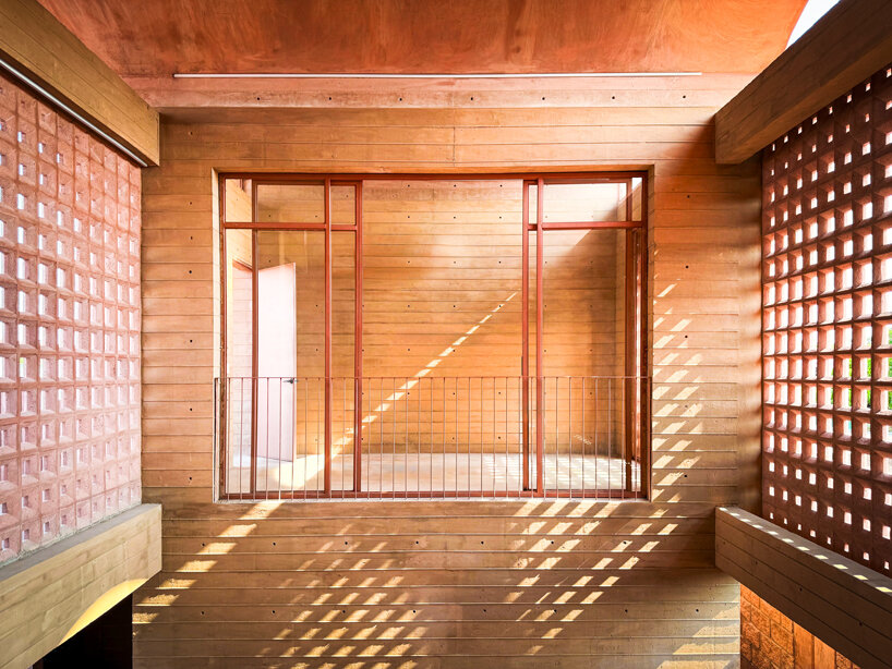 concrete lattice facade floods oaxacan community hub with patterned shadows