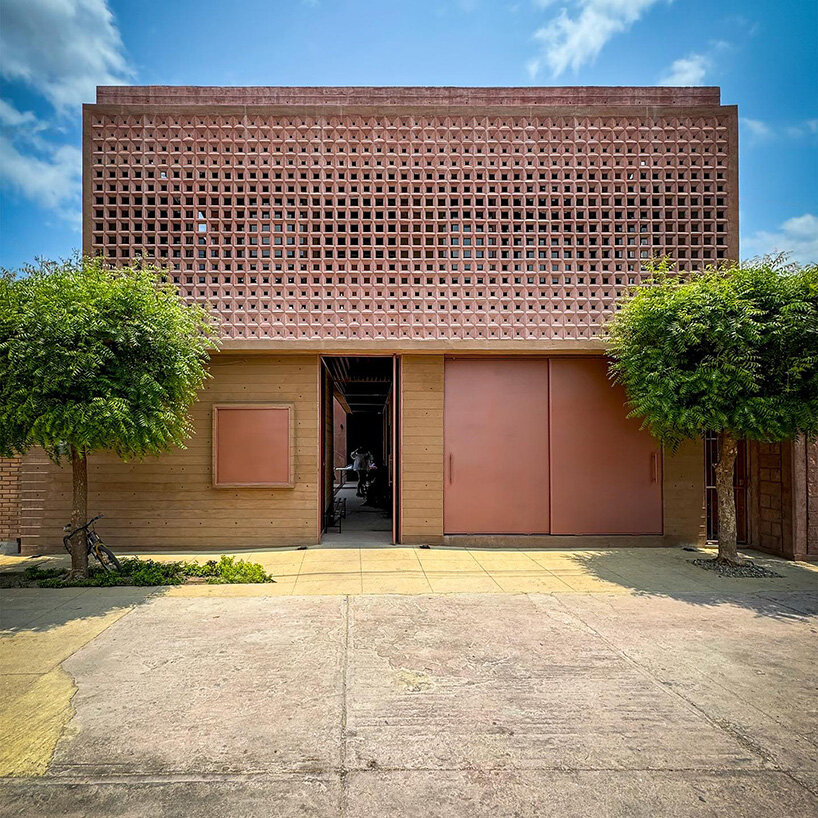 concrete lattice facade floods oaxacan community hub with patterned shadows